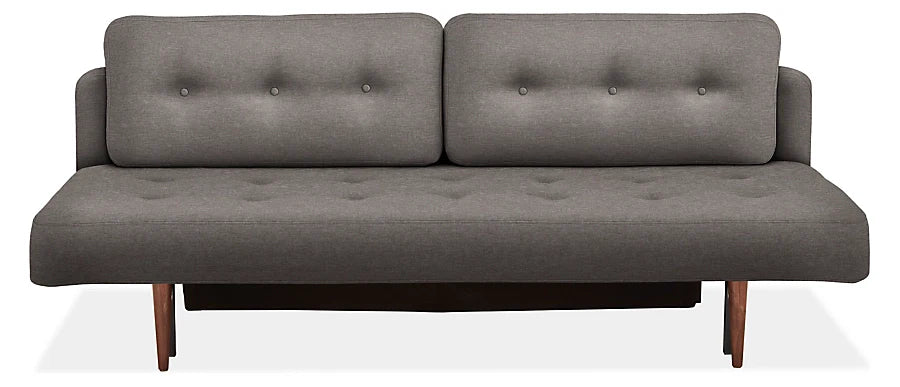 The Deco Convertible Sleeper Sofa is a contemporary gray piece with a minimalist design, boasting two back cushions and a flat seat, both adorned with button-tufted details. It features wooden legs and exudes a sleek and stylish look.
