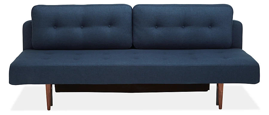 Introducing the Deco Convertible Sleeper Sofa, featuring a minimalist and sleek design with dark blue upholstery, button-tufted back cushions, and elegant wooden legs, perfect for a contemporary living space.