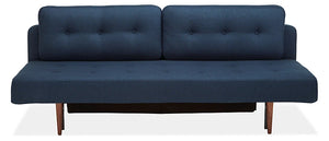 Introducing the Deco Convertible Sleeper Sofa, featuring a minimalist and sleek design with dark blue upholstery, button-tufted back cushions, and elegant wooden legs, perfect for a contemporary living space.