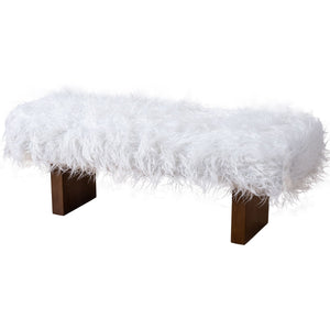 The Henley - Fur Bench - White Khaki features a rectangular shape with a fluffy white faux fur cushion and four sturdy wooden legs, offering a luxurious and comfortable appearance.