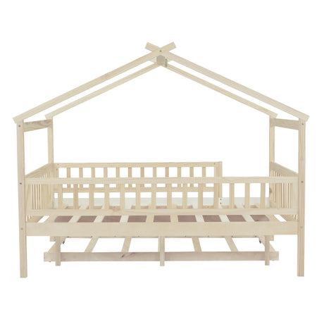 The Creativity House Bed With Twin Size Trundle features a wooden, house-shaped frame with open slats and a picket-fence balcony, complete with a pitched roof design.