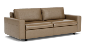 The Reva Storage Sofa features a light brown leather design with two seat cushions and two back cushions. It boasts wide armrests and short black legs, contributing to its modern and sleek appearance.
