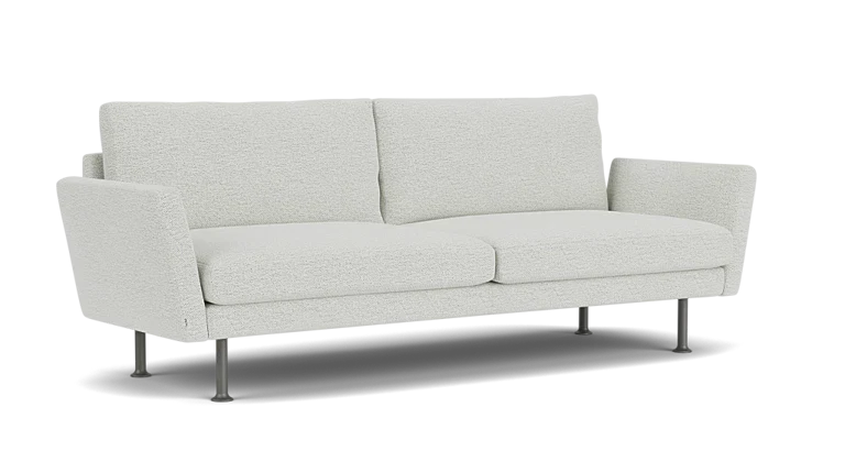 The Form 92" Sofa is a modern piece with light gray upholstery, straight lines, and a minimalist design. It features two seat cushions, two back cushions, and thin metal legs that contribute to its contemporary look.