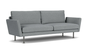 The Form 92" Sofa is a modern piece in gray, featuring two cushions and slim metal legs set against a plain black background. Its design includes slightly angled armrests and embodies a minimalist style.
