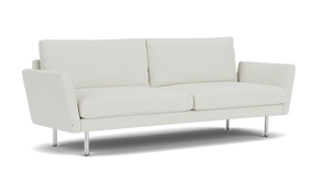 The Form 92" Sofa is a modern piece with clean lines, featuring two seat cushions and two back cushions. It has slim, angled armrests and stands on four sleek metal legs, exuding a minimalist and contemporary style.