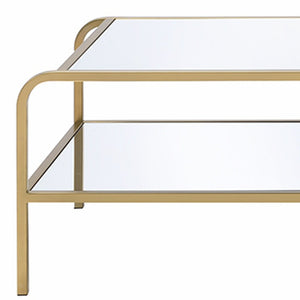 52" Clear and Gold Mirrored Glass And Iron Coffee Table With Shelf