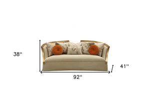 41" Beige Velvet Curved Sofa And Toss Pillows With Natural Legs