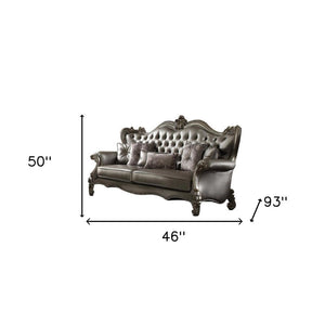 46" Platinum Faux Leather Curved Sofa And Toss Pillows