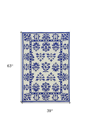 5' X 7' Sand Or Blue Floral Bordered Indoor Outdoor Area Rug