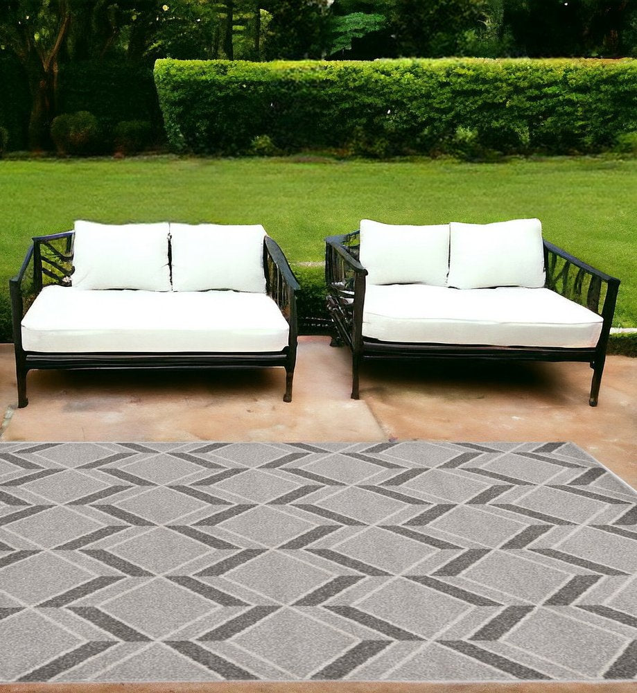 2' X 4' Green And Ivory Geometric Indoor Outdoor Area Rug