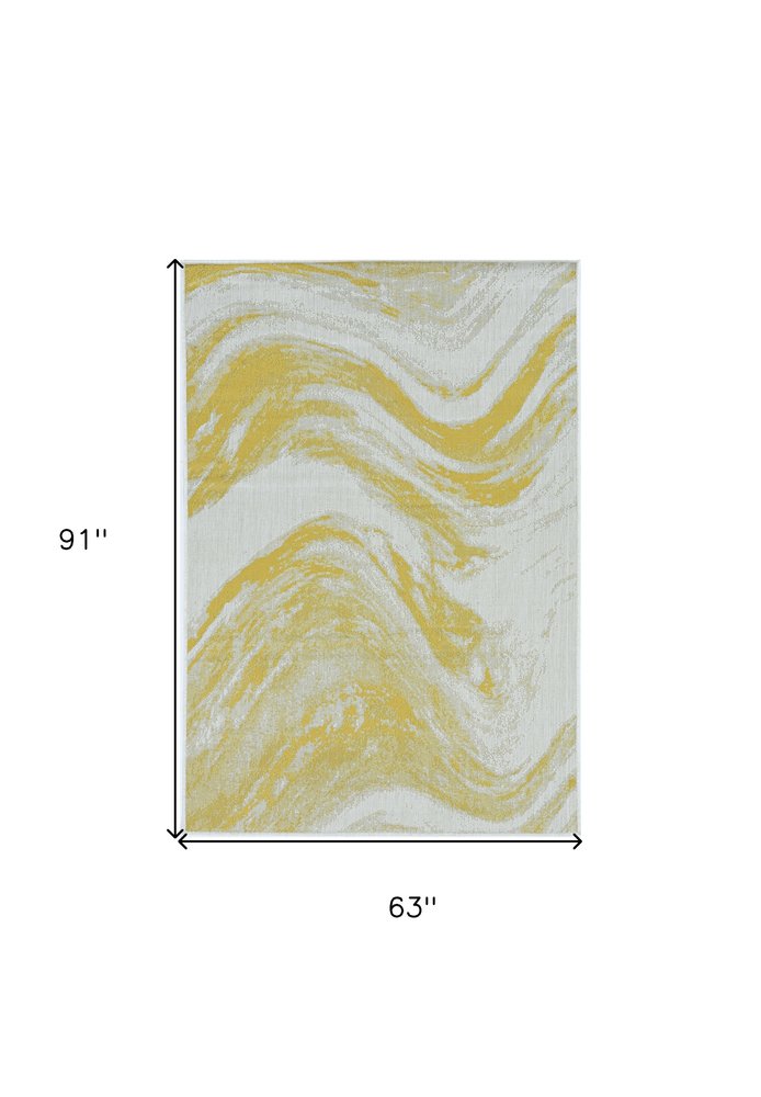 5' X 8' Gold And Ivory Abstract Indoor Outdoor Area Rug