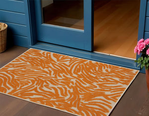 4' X 6' Orange And Ivory Abstract Stain Resistant Indoor Outdoor Area Rug