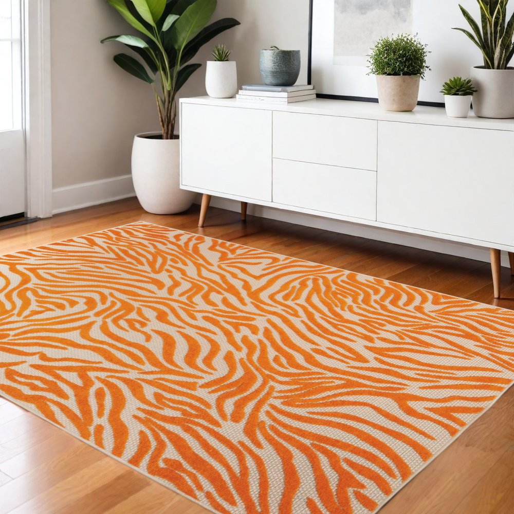4' X 6' Orange And Ivory Abstract Stain Resistant Indoor Outdoor Area Rug