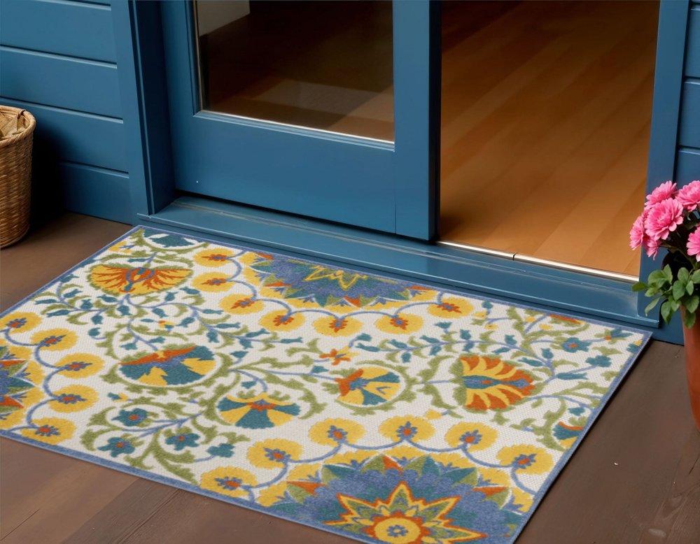 8' X 11' Ivory And Blue Floral Indoor Outdoor Area Rug