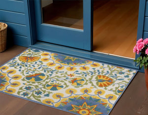 8' X 11' Ivory And Blue Floral Indoor Outdoor Area Rug