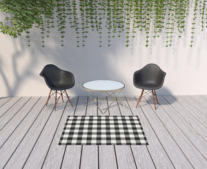 4' X 6' Black and Ivory Indoor Outdoor Area Rug
