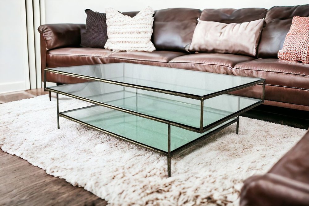 54" Clear and Brass Glass and Iron Coffee Table