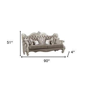 90" Gray Faux Leather Curved Sofa And Toss Pillows With Bone Legs