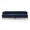 Introducing the Dylan Sofa by Four Hands, a sophisticated and contemporary piece featuring navy blue velvet upholstery with deep button tufting. Its design includes dark wooden legs and a rectangular shape with low back and armrests, all set against a plain white background.