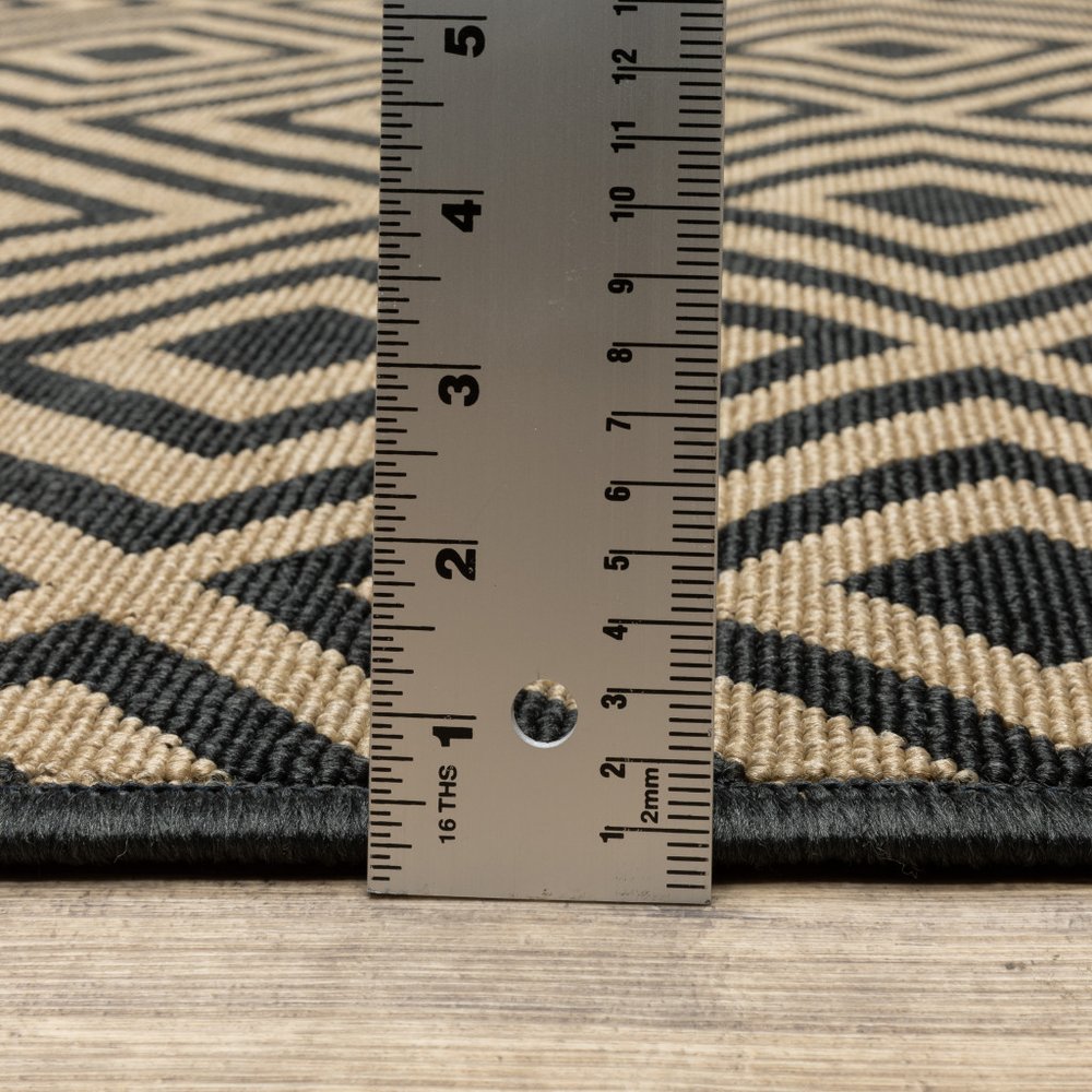 8' X 8' Black and Tan Round Geometric Stain Resistant Indoor Outdoor Area Rug