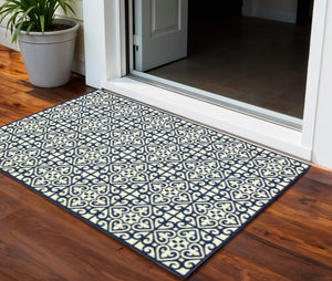 2' X 4' Ivory and Blue Geometric Stain Resistant Indoor Outdoor Area Rug