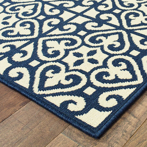 5' X 8' Ivory and Blue Geometric Stain Resistant Indoor Outdoor Area Rug