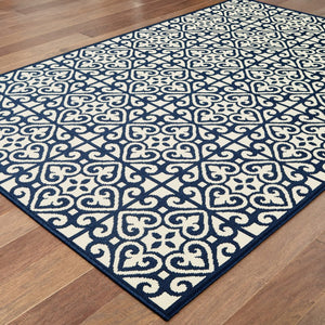 5' X 8' Ivory and Blue Geometric Stain Resistant Indoor Outdoor Area Rug