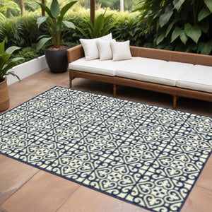 7' X 10' Ivory and Blue Geometric Stain Resistant Indoor Outdoor Area Rug