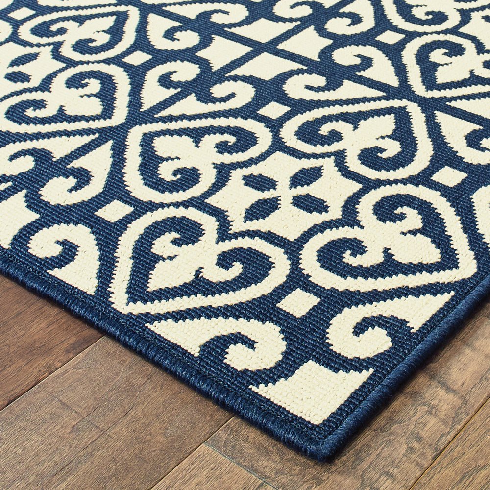 8' X 11' Ivory and Blue Geometric Stain Resistant Indoor Outdoor Area Rug