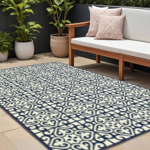 8' X 11' Ivory and Blue Geometric Stain Resistant Indoor Outdoor Area Rug