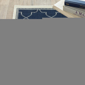 5' X 8' Blue and Ivory Geometric Stain Resistant Indoor Outdoor Area Rug