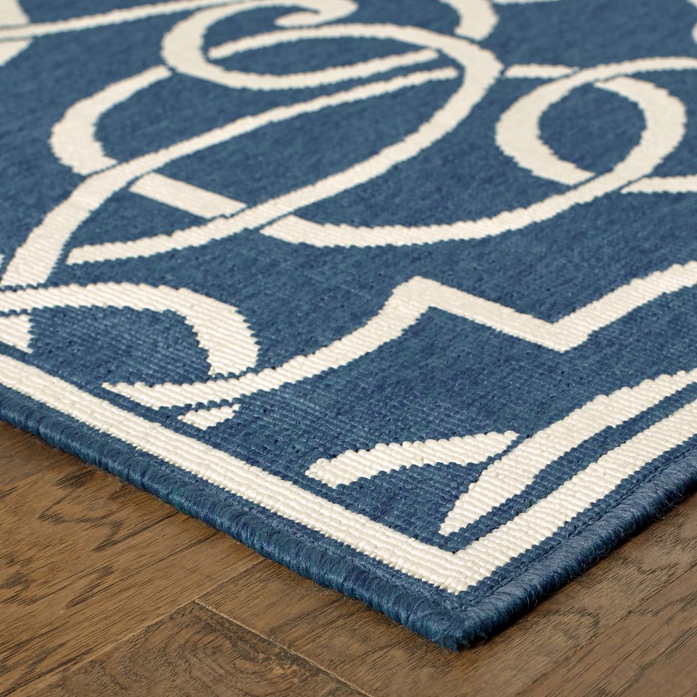 5' X 8' Blue and Ivory Geometric Stain Resistant Indoor Outdoor Area Rug