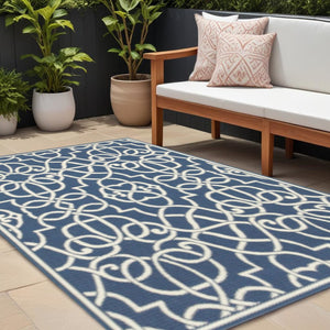 8' X 11' Blue and Ivory Geometric Stain Resistant Indoor Outdoor Area Rug