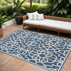 9' X 13' Blue and Ivory Geometric Stain Resistant Indoor Outdoor Area Rug