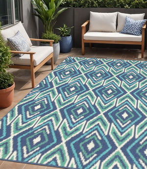5' X 8' Blue and Ivory Geometric Stain Resistant Indoor Outdoor Area Rug