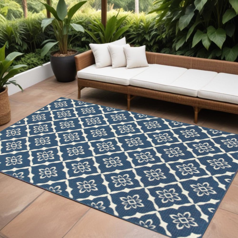 7' x 10' Blue and Ivory Floral Stain Resistant Indoor Outdoor Area Rug