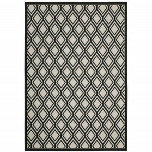 7' X 9' Beige and Black Geometric Stain Resistant Indoor Outdoor Area Rug