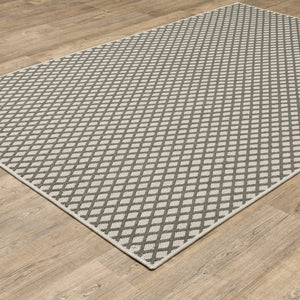 5' X 7' Beige Geometric Stain Resistant Indoor Outdoor Area Rug