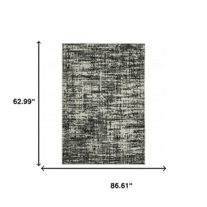 5' X 7' Beige and Black Abstract Stain Resistant Indoor Outdoor Area Rug