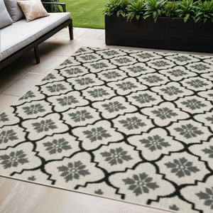 5' X 7' Beige and Black Geometric Stain Resistant Indoor Outdoor Area Rug
