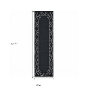 2' X 8' Black and Ivory Stain Resistant Indoor Outdoor Area Rug