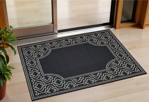 2' X 4' Black and Ivory Stain Resistant Indoor Outdoor Area Rug