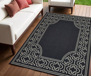 4' X 6' Black and Ivory Stain Resistant Indoor Outdoor Area Rug