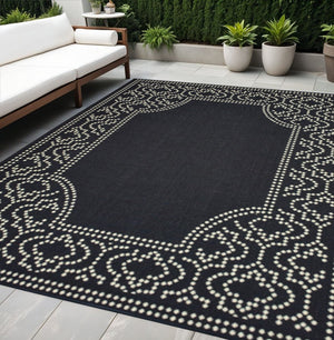 5' X 8' Black and Ivory Stain Resistant Indoor Outdoor Area Rug