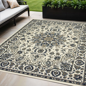 5' X 8' Ivory and Blue Oriental Stain Resistant Indoor Outdoor Area Rug