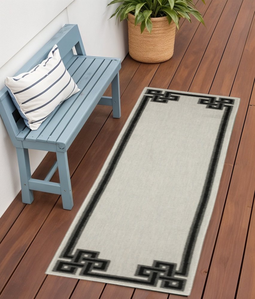 2' X 7' Beige and Black Stain Resistant Indoor Outdoor Area Rug