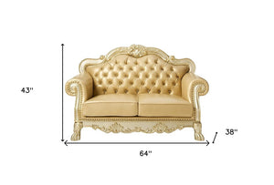 64" Bone And Gold Faux Leather Loveseat and Toss Pillows