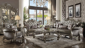 44" Silver and Platinum Faux Leather Tufted Wingback Chair And Toss Pillows