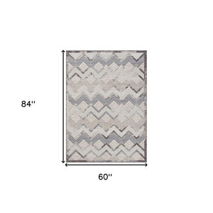 5' X 7' Blue And Ivory Chevron Indoor Outdoor Area Rug