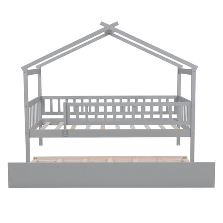The Creativity House Bed with Twin Size Trundle features a grey, playhouse-inspired wooden frame with a railing and a trundle drawer, perfect for a child's room.
